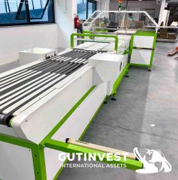 1  -  Automatic garment folding and packaging machine