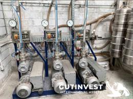 1  -  Instalación para alimentación de material a inyectoras de p