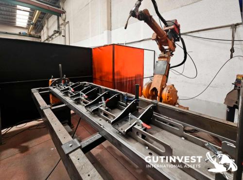 Welding robot with turn-over table