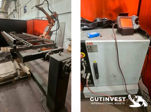 Welding robot with turn-over table