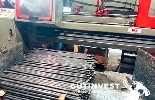 Automatic sawing machine for metal tubes and bars