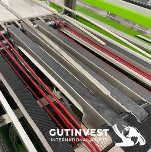 Máquina automática de doblado y embalaje de prendas