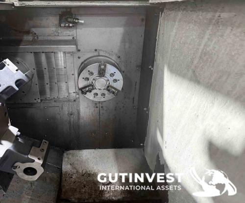 Torno doble cabezal con robot gantry