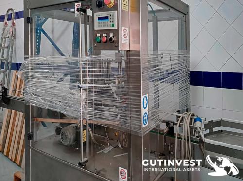 Precintadora automática de botellas de vidrio