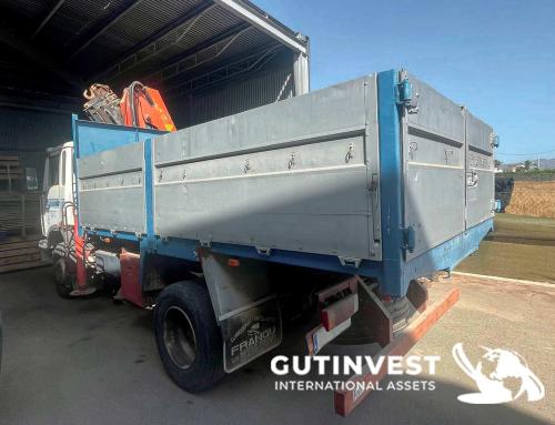 Truck with open box and crane