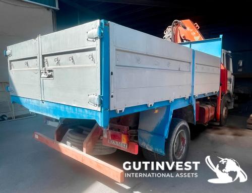 Truck with open box and crane