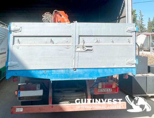 Truck with open box and crane