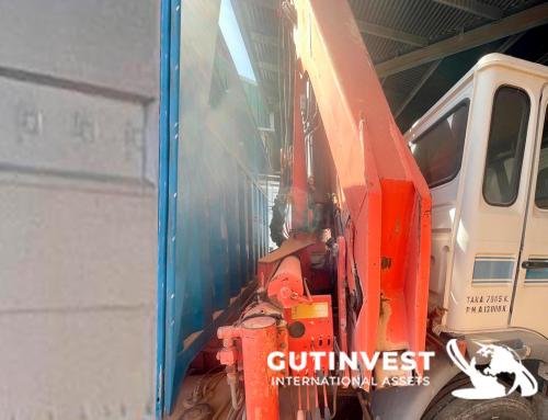 Truck with open box and crane